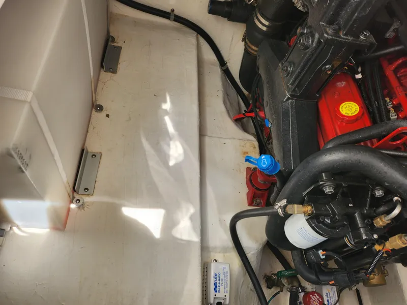 Slide: The Image of Engine compartment of a 2008 Glastron GT 249 boat showing engine and components. - 19