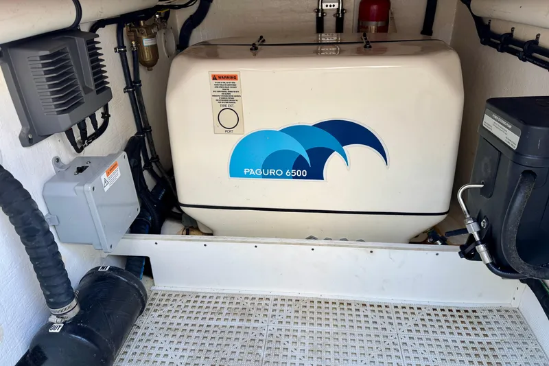 Slide: The Image of Engine room of 2022 Intrepid 409 Valor featuring Paguro 6500 generator. - 13