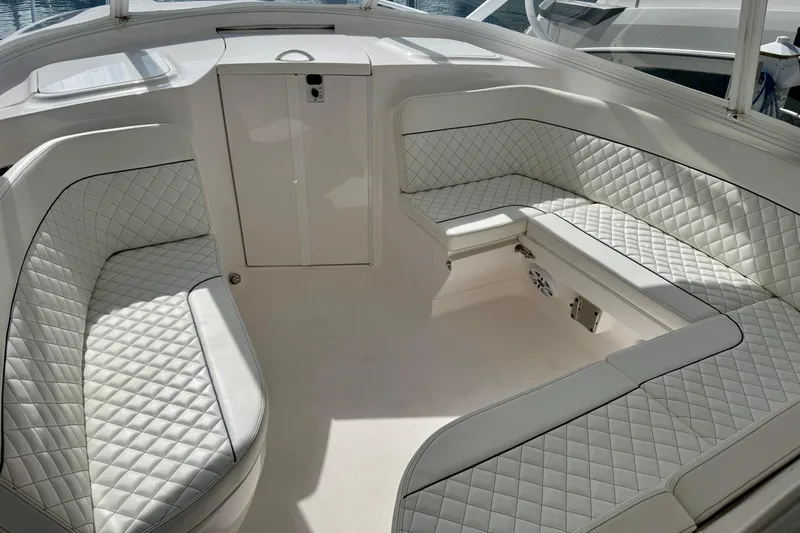 Slide: The Image of Luxurious seating area on 2022 Intrepid 409 Valor boat with quilted white upholstery. - 14