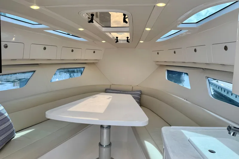 Slide: The Image of Luxurious interior of 2022 Intrepid 409 Valor yacht with elegant seating and skylights. - 16