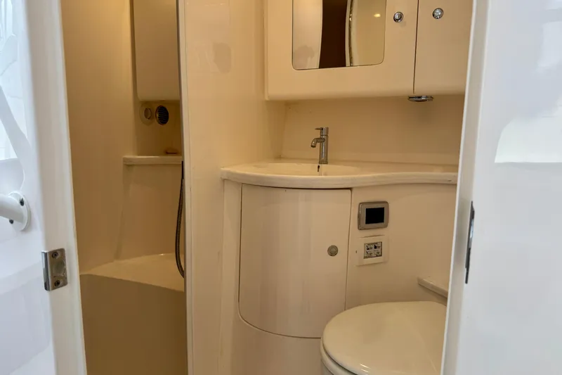 Slide: The Image of 2022 Intrepid 409 Valor boat bathroom with sink, toilet, and shower. - 17
