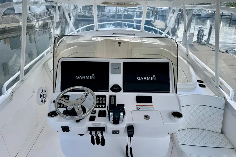 Slide: The Image of 2022 Intrepid 409 Valor helm with Garmin displays and luxurious seating. - 26