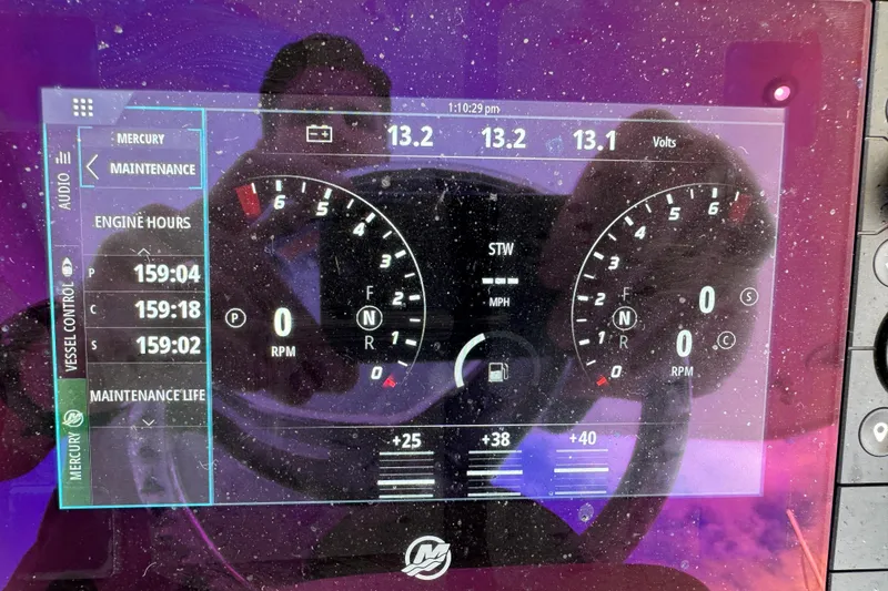 Slide: The Image of Dashboard of a 2022 Intrepid 409 Valor boat showing engine hours and RPM gauges. - 9