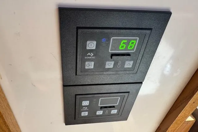 Slide: The Image of Control panel on a 1985 Symbol 58 Cockpit Motor Yacht displaying temperature settings. - 10