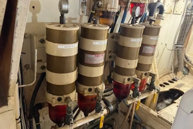 Slide: The Image of Fuel filters in the engine room of a 1985 Symbol 58 Cockpit Motor Yacht. - 30