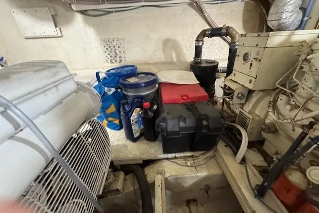 Slide: The Image of Engine room of 1985 Symbol 58 Cockpit Motor Yacht with maintenance supplies. - 35