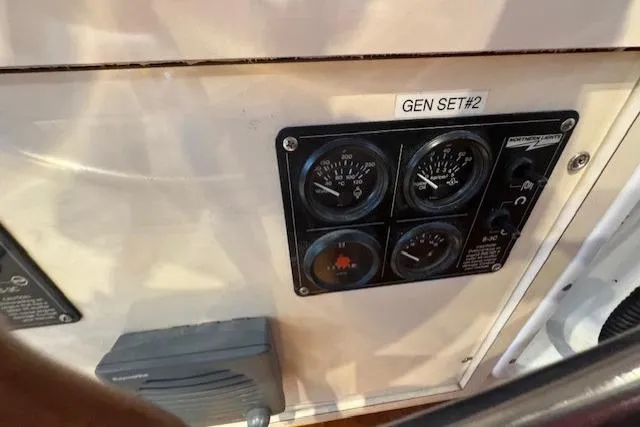 Slide: The Image of Control panel of 1985 Symbol 58 Cockpit Motor Yacht, labeled "GEN SET #2". - 39