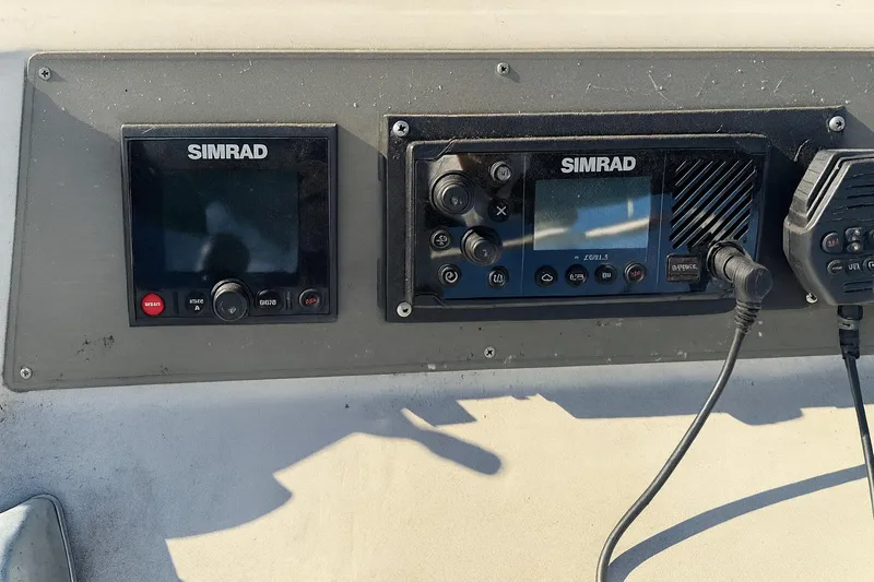 Slide: The Image of Simrad navigation equipment on 1985 Symbol 58 Cockpit Motor Yacht dashboard. - 42