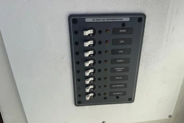 Slide: The Image of Control panel of a 1985 Symbol 58 Cockpit Motor Yacht, featuring 12-volt DC distribution. - 45