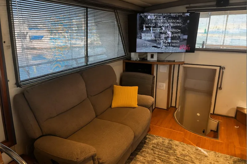 Slide: The Image of Interior of 1985 Symbol 58 Cockpit Motor Yacht with sofa and TV. - 5