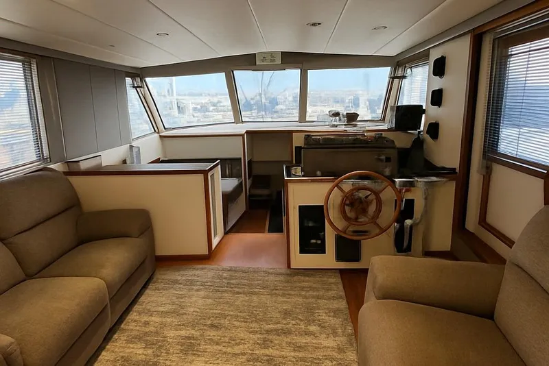 Slide: The Image of Interior of 1985 Symbol 58 Cockpit Motor Yacht with helm and seating area. - 8