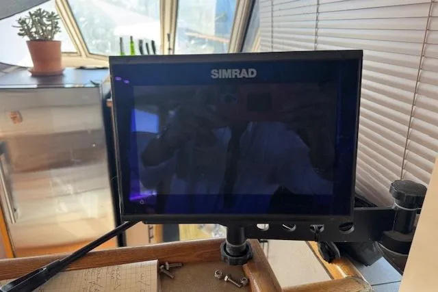 Slide: The Image of Simrad display on 1985 Symbol 58 Cockpit Motor Yacht, interior view with potted plant. - 9
