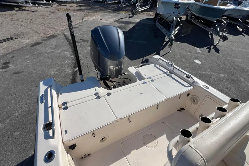 Slide: The Image of 2018 Grady-White 251 Coastal Explorer boat with Yamaha 300 engine, docked on pavement. - 5