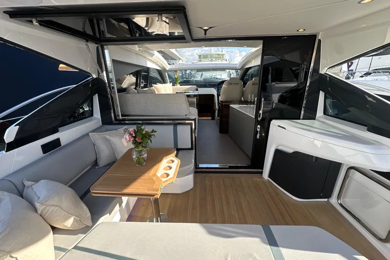 Slide: The Image of Interior view of 2026 Fairline Targa 47 GT yacht with luxurious seating and helm. - 20