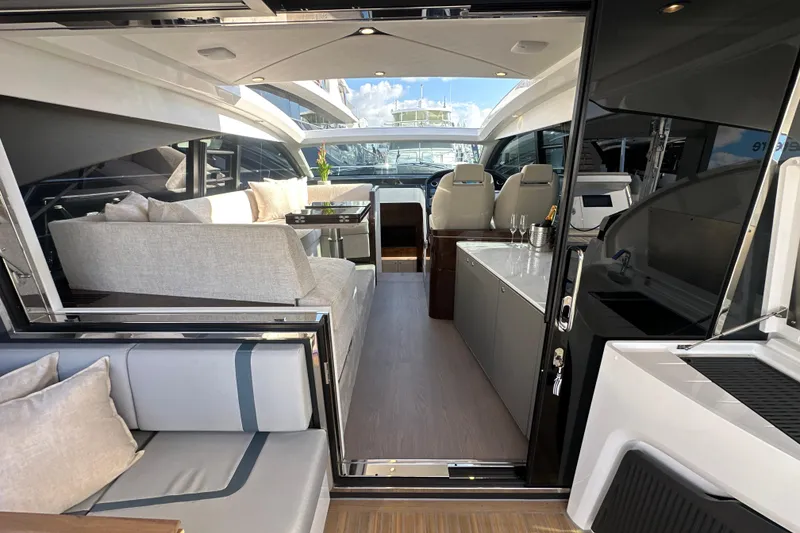 Slide: The Image of Interior of 2026 Fairline Targa 47 GT yacht with modern helm and plush seating. - 22