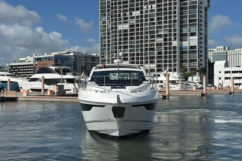 Slide: The Image of 2026 Fairline Targa 47 GT yacht docked in urban marina setting. - 3