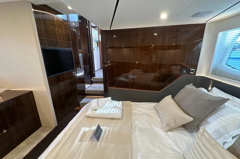Slide: The Image of Luxurious interior of 2026 Fairline Targa 47 GT yacht with marina view. - 47
