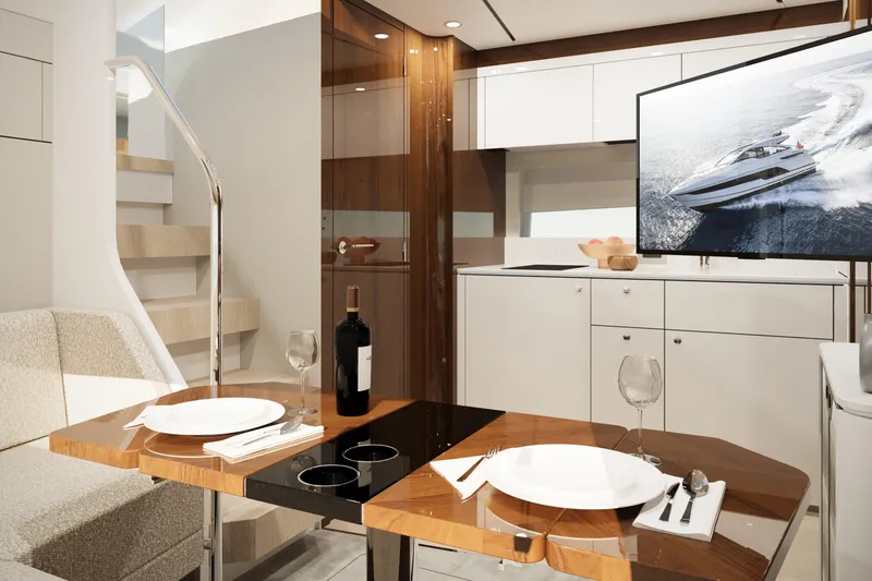 Slide: The Image of Luxurious interior of 2026 Fairline Targa 47 GT yacht with elegant dining setup. - 5
