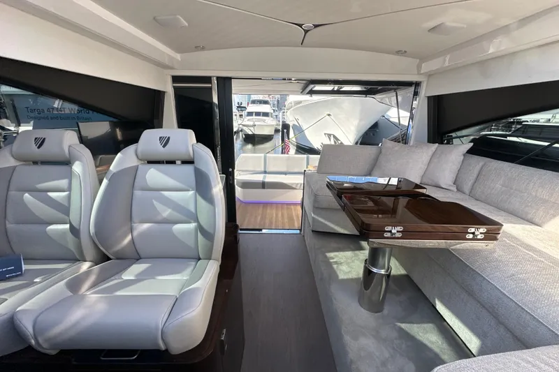 Slide: The Image of 2026 Fairline Targa 47 GT yacht docked, showcasing sleek design and spacious deck. - 51