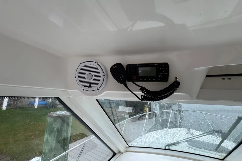 Slide: The Image of 2016 Boston Whaler 315 Conquest interior with speaker and radio system. - 21