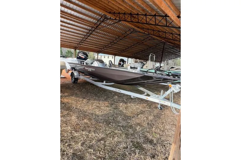 Slide: The Image of 2025 G3 Sportsman 1910 boat on trailer under a metal canopy. - 5
