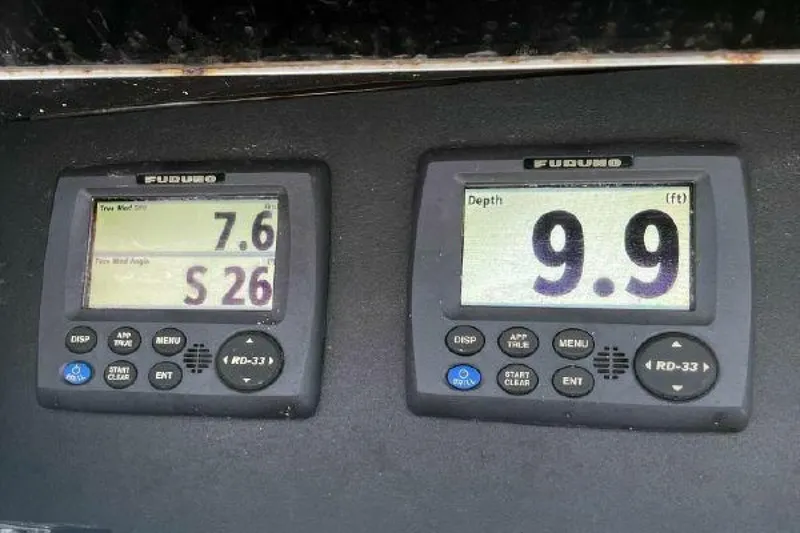 Slide: The Image of Furuno navigation instruments on a 1981 Bertram Convertible boat displaying wind speed and depth. - 16