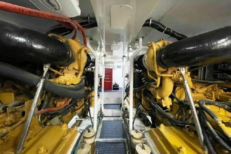 Slide: The Image of Engine room of a 1981 Bertram Convertible boat with dual engines. - 40
