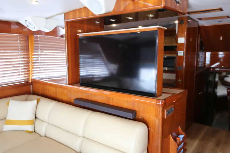 Slide: The Image of Luxurious interior of 1981 Bertram Convertible yacht with TV and leather seating. - 46