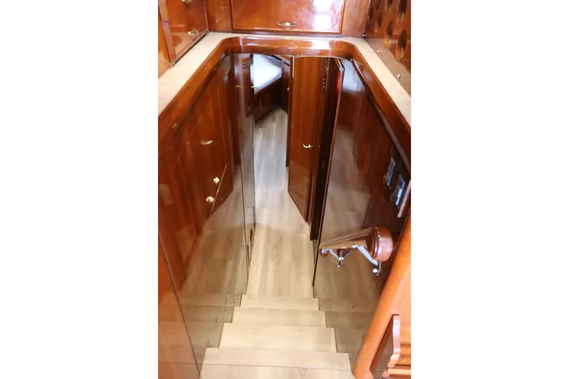 Slide: The Image of Staircase with wooden cabinetry inside a 1981 Bertram Convertible yacht. - 51