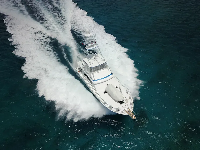 Slide: The Image of 1981 Bertram Convertible yacht cruising on open water. - 6