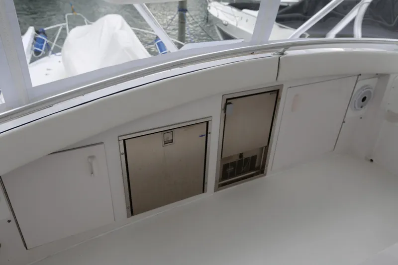 Slide: The Image of 1981 Bertram Convertible boat interior with storage compartments and sleek design. - 71