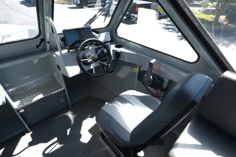 Slide: The Image of 2019 Hewescraft 200 ProV boat interior with steering wheel and control panel. - 12