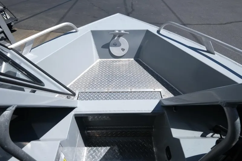 Slide: The Image of 2019 Hewescraft 200 ProV boat interior with diamond plate flooring and railing. - 14