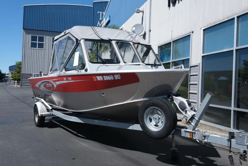 Slide: The Image of 2019 Hewescraft 200 ProV boat on trailer outside a building. - 3