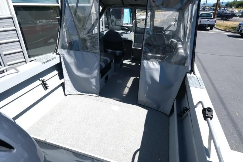 Slide: The Image of 2019 Hewescraft 200 ProV boat interior with seating and protective covers. - 7
