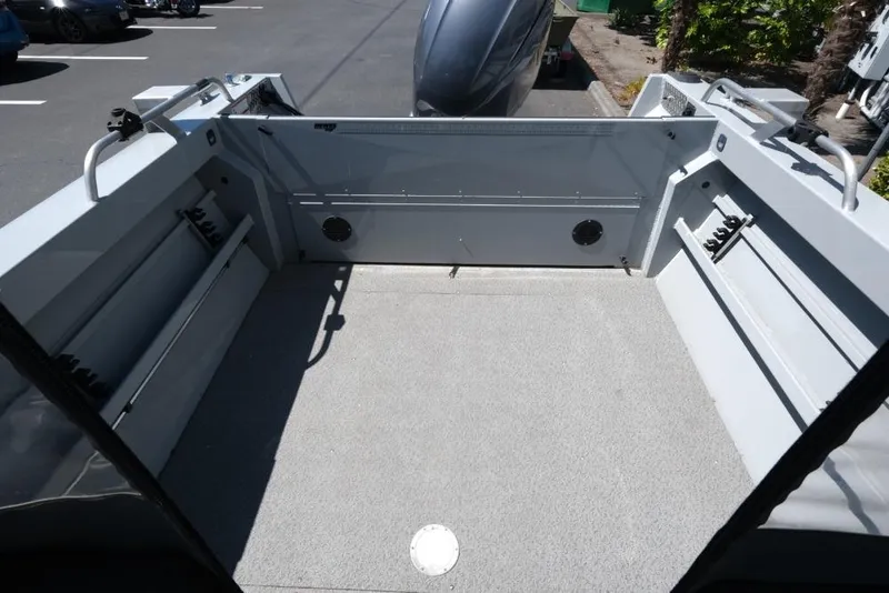 Slide: The Image of 2019 Hewescraft 200 ProV boat interior with spacious deck and storage compartments. - 8