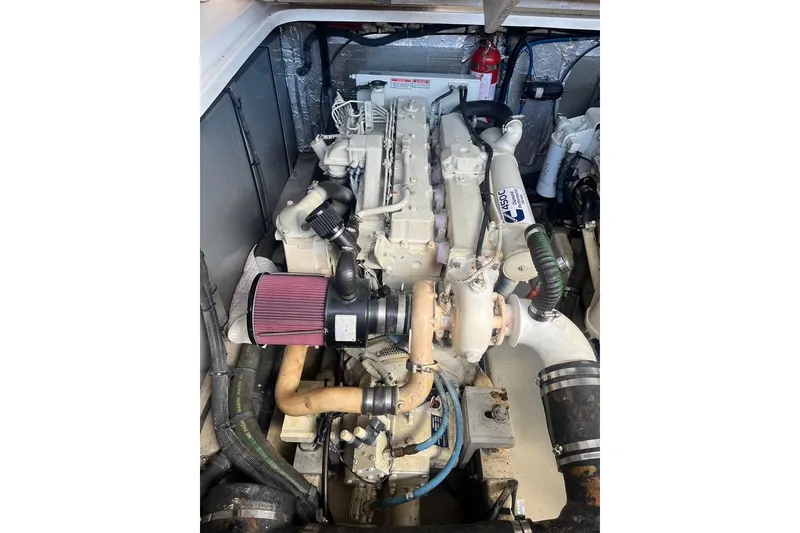 Slide: The Image of Engine compartment of a 2003 Sea Ray 410 Express Cruiser, showcasing detailed components. - 14