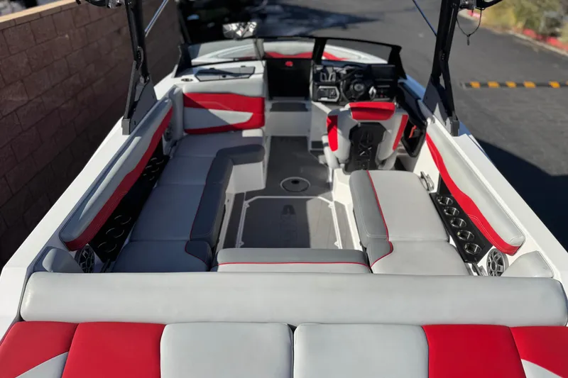 Slide: The Image of 2023 Axis T220 boat interior with red and gray seating, showcasing modern design. - 11