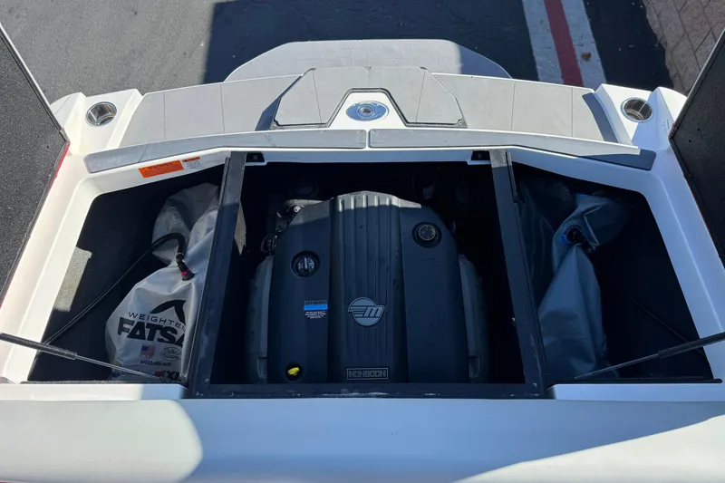 Slide: The Image of 2023 Axis T220 boat engine compartment with ballast bags and engine cover. - 22