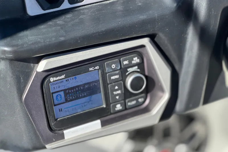 Slide: The Image of Close-up of 2023 Axis T220 boat's Bluetooth audio system display. - 34