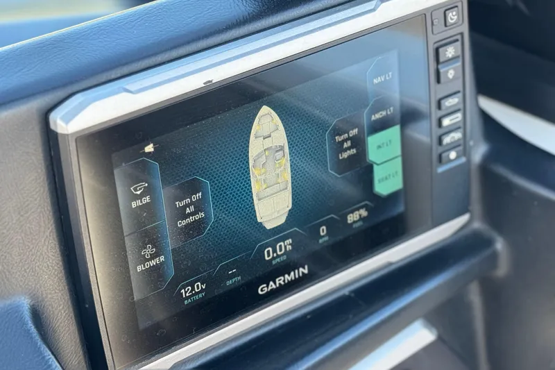 Slide: The Image of Garmin display in 2023 Axis T220 boat showing navigation and control options. - 35
