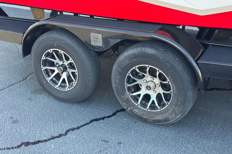 Slide: The Image of 2023 Axis T220 trailer wheels with stylish alloy rims on a textured surface. - 40