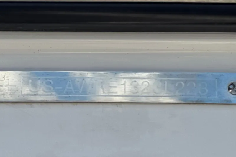 Slide: The Image of Metallic identification plate on 2023 Axis T220 boat. - 43