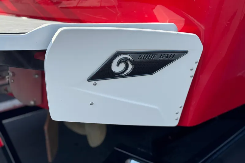 Slide: The Image of 2023 Axis T220 boat with Surf Gate feature, red and white design. - 9