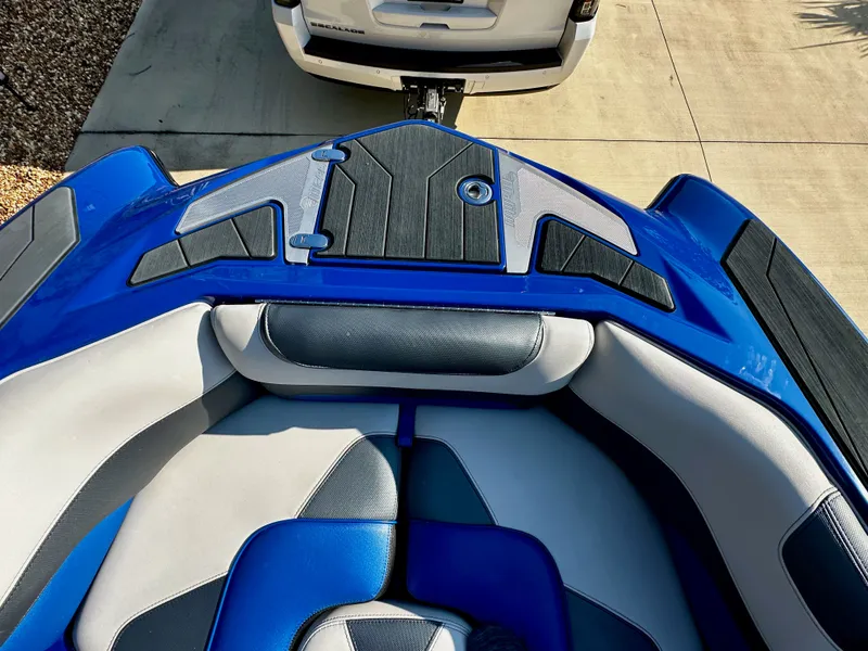 Slide: The Image of 2017 Malibu M235 boat with blue and gray interior. - 18