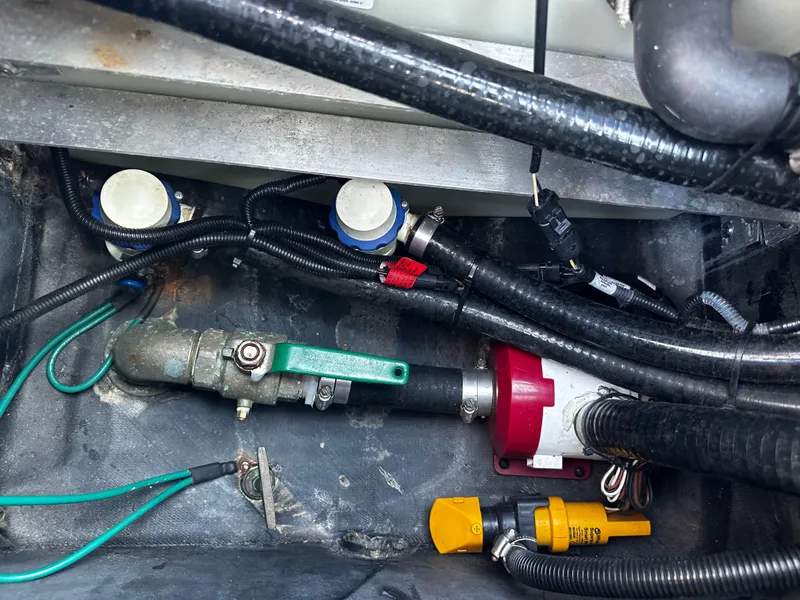 Slide: The Image of Engine compartment of 2017 Malibu M235 with cables and valves. - 32