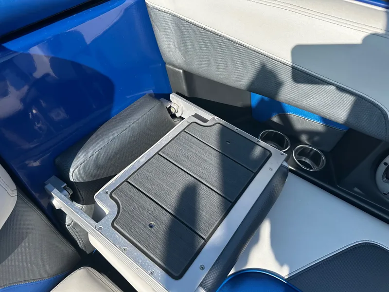 Slide: The Image of Interior of a 2017 Malibu M235 boat with blue and gray seating. - 37