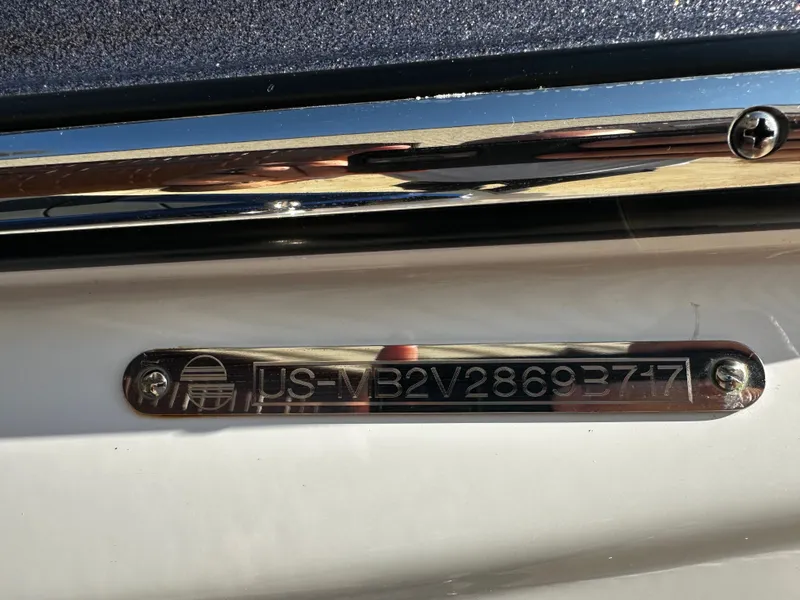 Slide: The Image of Serial number plate of a 2017 Malibu M235 boat. - 39