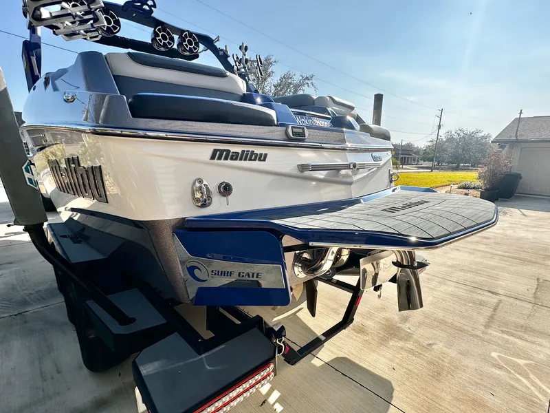 Slide: The Image of 2017 Malibu M235 boat with Surf Gate technology. - 4