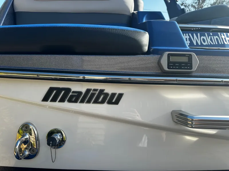 Slide: The Image of Close-up of a 2017 Malibu M235 boat with logo. - 44